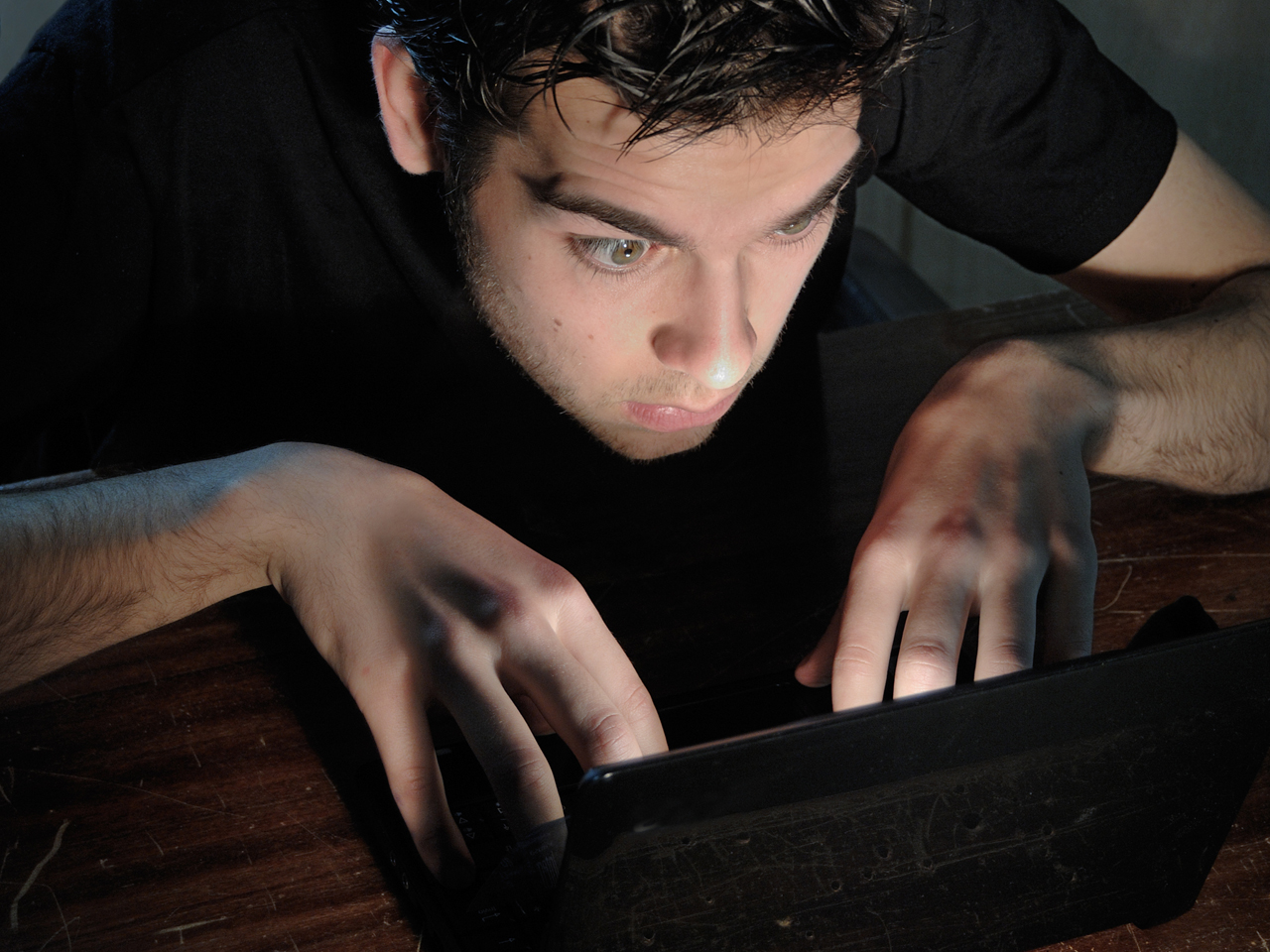 Young man totally absorbed in on-line activity
